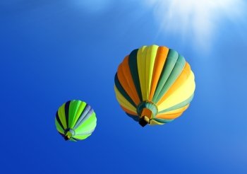 colorful soar hot air balloons on blue sky