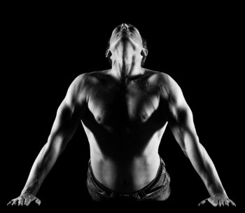 Handsome caucasian man stretching, black and white image front