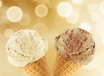 Vanilla and chocolate Ice cream in the cone with abstract light background.. Ice Cream