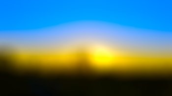 Blue yellow sunset abstract blur background.