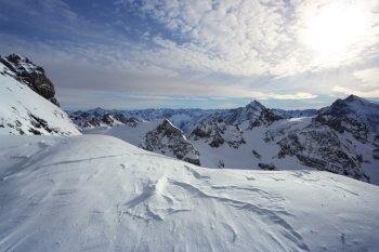 View of the snowy peaks of the Swiss Alps while standing on Titlis.