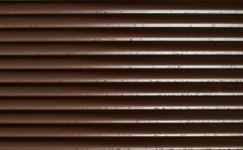Closeup of Brown Blinds With Rain Drops