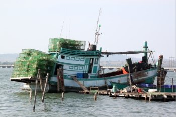 Fishing boat with net near thye sea coast in Cambodia