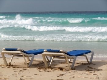 Chairs on the sand beach in island Barbados          