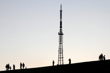 People and antenna on the Mamaev kurgan in Volgograd, Russia