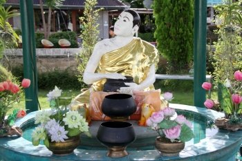 Fountain with white statue monk, Mae Hong Son, Thailand