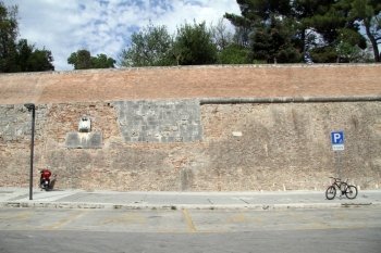 Parking near brick wall in the center of Zadar, Croatia