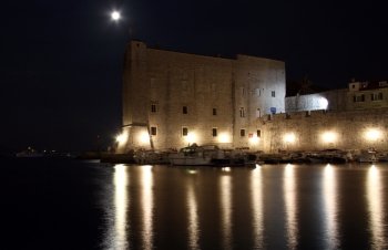 Moon and wall of fortress in Dubrovnic, Croatia