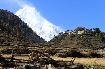 Buddhist monsstery on the hill and Manaslu peak