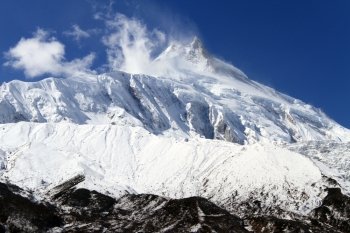 Cloud nd snow on the top of Manaslu mount in NEpal