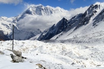 Post and snow near Larke pass in Nepal