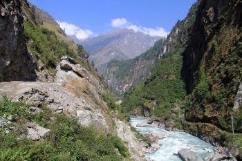 Road on the Annapurna trail and river in Nepal