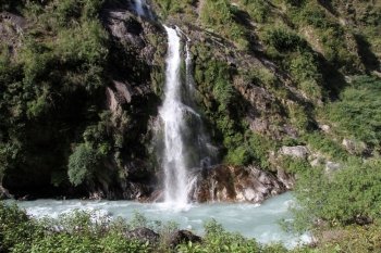 Waterfall on the rock and river in mountain, Nepal
