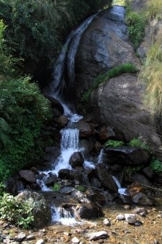 Narrow river and small waterfall in Nepal