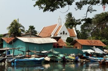 White church and boats in Negombo, Sri Lanka