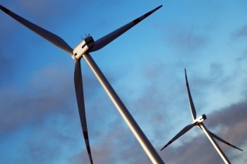 Wind turbines energy concept on blue sky