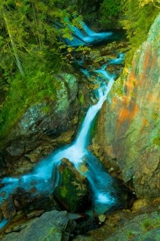 Waterfall in mountains. Vibrant, colorful, Tatra mountains