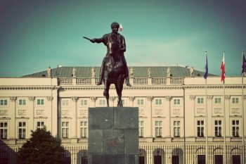 Retro vintage version of The Presidential Palace in Warsaw, Poland and the statue of Jozef Poniatowski