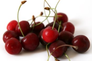 red cherries on a white background. cherries