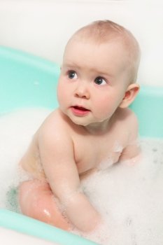 face of little baby which takes a bath. little baby takes a bath