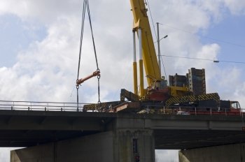 A huge crane lifting a bridge part during mainenance work on the A9 Highway near Haarlem, the Netherlands.