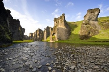 An ancient Canyon in Hunkarbakkar, Iceland, where the different layers of volcanic branch pipes have created hard structures, which still stand erect, when over time, the softer ashes and eruption debris has been eroded away, forming the erratic banks of the canyon
