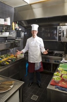 A chef in his kitchen, preparing dinner
