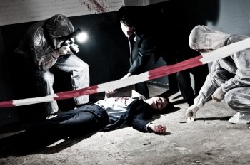 A cross processed murder scene with two forensic analysts and a police lieutenant investigating a crime on a businessman in a basementMurder scene with two forensic analysts and a police lieutenant investigating a crime on a businessman in a basement
