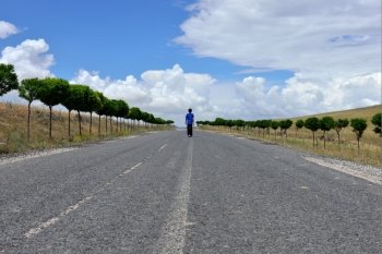 Child walking on a countryside road