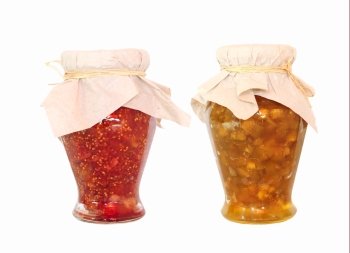 Two jars of fruit jam isolated on white background