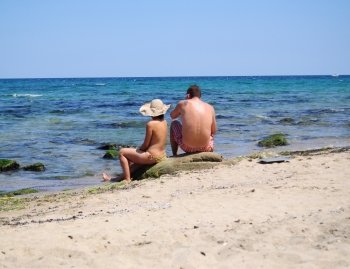 Young couple chilling on the beach