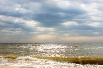 Cloudy sky above a sea, background

