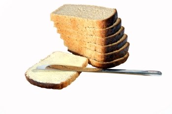 Bread butter a knife on the white background. (isolated)
