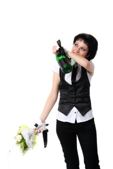 Bride drinking from a bottle of champagne on the white background
