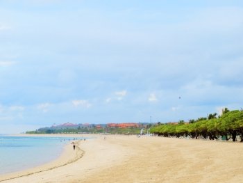 Bali sunny ocean beach with cloudy sky.. Bali island coastline 