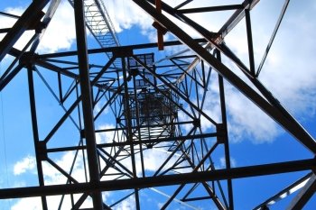 abstract high-voltage tower on blue sky background