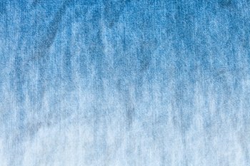 blue and white dyeing of denim jean - textile background close up