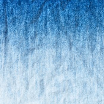 blue and white gradient on denim jean - textile background close up