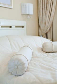 Elegant pillows on bed