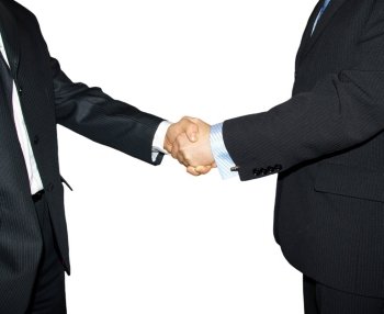 Men are shaking hands on a grey background. 
