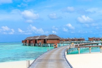  beach with water bungalows at Maldives