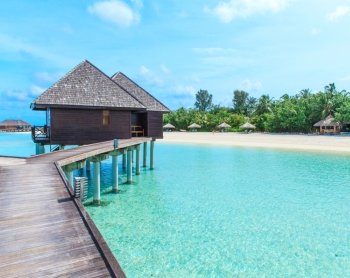 beach with water bungalows at Maldives


