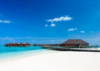  beach with water bungalows at Maldives