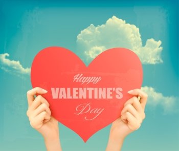 Two hands holding red heart Valentine’s day retro background. Vector