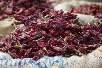 Dried red chili peppers in sacks in India Goa. Dried red chili peppers in sacks in India Goa.