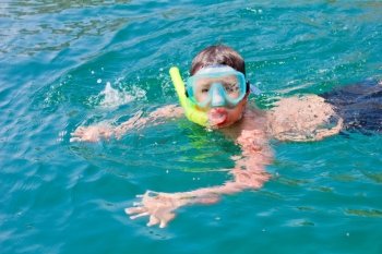 boy swims in the sea