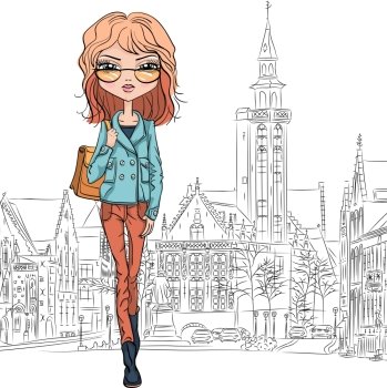Beautiful fashion girl top model in glasses with bag on a medieval city Bruges street