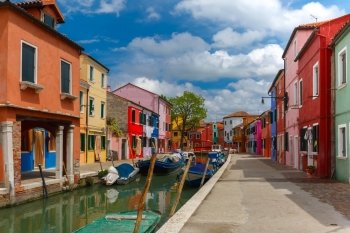 Canal with colorful houses on the famous island Burano, Venice, Italy
