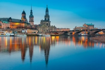 Dresden Cathedral of the Holy Trinity or Hofkirche, Bruehl&#39;s Terrace or The Balcony of Europe, Semperoper and Augustus Bridge with reflections in the river Elbe at night in Dresden, Saxony, Germany