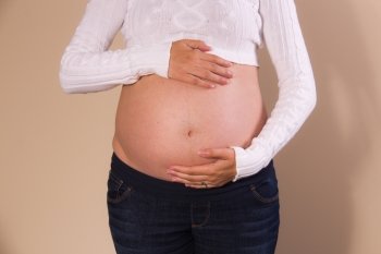 Front view of exposed belly of a pregnant girl